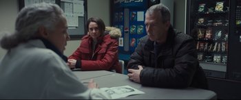 Movie still from “To Catch a Killer” (2023), directed by Damián Szifron – A man and a woman sitting at a table; Medium shot, Over the shoulder angle