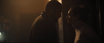 Movie still from “To Catch a Killer” (2023), directed by Damián Szifron – A man and a woman face to face in the dark; Close Up shot, Over the shoulder angle