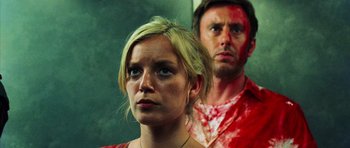Movie still from “Dawn of the Dead” (2004), directed by Zack Snyder – A woman and a man are standing next to each other; Close Up shot, Low angle