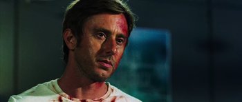 Movie still from “Dawn of the Dead” (2004), directed by Zack Snyder – A person with blood on his face; Close Up shot, Low angle