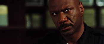 Movie still from “Dawn of the Dead” (2004), directed by Zack Snyder – A person with a beard; Close Up shot, Low angle