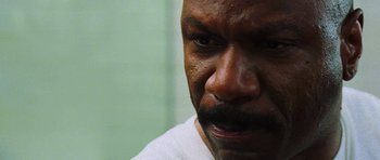 Movie still from “Dawn of the Dead” (2004), directed by Zack Snyder – A person with a beard; Close Up shot, High angle