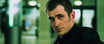 Movie still from “Dawn of the Dead” (2004), directed by Zack Snyder – A person wearing a black shirt; Close Up shot, Low angle