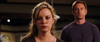 Movie still from “Dawn of the Dead” (2004), directed by Zack Snyder – A person wearing a black shirt; Close Up shot, Low angle