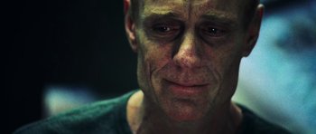 Movie still from “Dawn of the Dead” (2004), directed by Zack Snyder – A person with a sad look on his face; Close Up shot, Over the shoulder angle