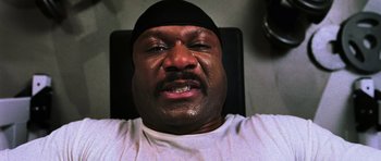 Movie still from “Dawn of the Dead” (2004), directed by Zack Snyder – A person with a black hat; Close Up shot, Overhead angle