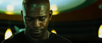 Movie still from “Dawn of the Dead” (2004), directed by Zack Snyder – A person with his eyes closed; Close Up shot, Low angle