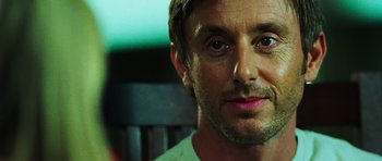Movie still from “Dawn of the Dead” (2004), directed by Zack Snyder – A man's face in a room; Close Up shot, Over the shoulder angle