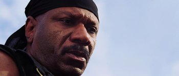 Movie still from “Dawn of the Dead” (2004), directed by Zack Snyder – A man with a black hat; Close Up shot, Low angle