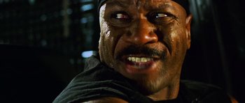 Movie still from “Dawn of the Dead” (2004), directed by Zack Snyder – A man's teeth and face; Close Up shot, Low angle