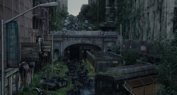 Movie still from “Dawn of the Planet of the Apes” (2014), directed by Matt Reeves – An abandoned city with a bridge over a river; Extreme Wide shot, High angle