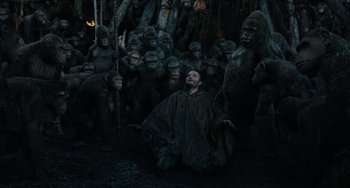 Movie still from “Dawn of the Planet of the Apes” (2014), directed by Matt Reeves – A group of people dressed in gorilla costumes; Wide shot, High angle