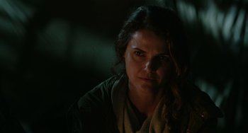 Movie still from “Dawn of the Planet of the Apes” (2014), directed by Matt Reeves – A person wearing a scarf; Close Up shot, Over the shoulder angle