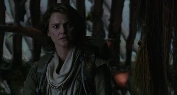 Movie still from “Dawn of the Planet of the Apes” (2014), directed by Matt Reeves – A person wearing a jacket; Close Up shot, Over the shoulder angle