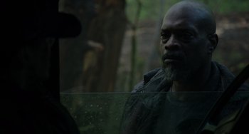 Movie still from “Dawn of the Planet of the Apes” (2014), directed by Matt Reeves – A man with a beard looking out of a car window; Close Up shot, Over the shoulder angle