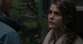 Movie still from “Dawn of the Planet of the Apes” (2014), directed by Matt Reeves – A person wearing a towel; Close Up shot, Over the shoulder angle