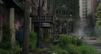 Movie still from “Dawn of the Planet of the Apes” (2014), directed by Matt Reeves – An abandoned building with trees in the background; Extreme Wide shot, High angle