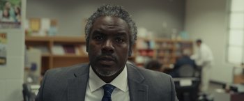 Movie still from “Dear Evan Hansen” (2021), directed by Stephen Chbosky – A person wearing a suit and tie; Close Up shot, Low angle