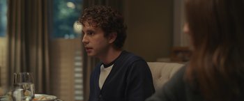 Movie still from “Dear Evan Hansen” (2021), directed by Stephen Chbosky – A man sitting in a chair looking at the camera; Close Up shot, Over the shoulder angle