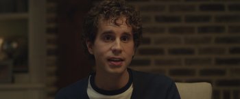 Movie still from “Dear Evan Hansen” (2021), directed by Stephen Chbosky – A man with curly brown hair is looking at the camera; Close Up shot, Over the shoulder angle