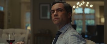 Movie still from “Dear Evan Hansen” (2021), directed by Stephen Chbosky – A person wearing a shirt and a tie; Close Up shot, Over the shoulder angle