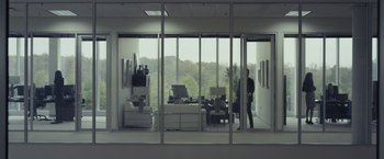 Movie still from “Dear Evan Hansen” (2021), directed by Stephen Chbosky – A man standing in a room with a large window; Wide shot, Over the shoulder angle