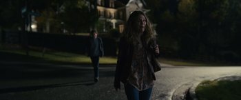 Movie still from “Dear Evan Hansen” (2021), directed by Stephen Chbosky – A woman walking down a street with a boy; Medium shot, Over the shoulder angle