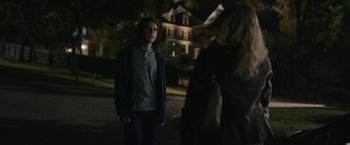 Movie still from “Dear Evan Hansen” (2021), directed by Stephen Chbosky – A man and a woman standing in front of a house; Medium shot, Over the shoulder angle