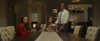 Movie still from “Dear Evan Hansen” (2021), directed by Stephen Chbosky – A man and a woman sitting in front of a laptop; Medium shot, Low angle