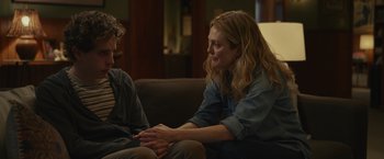 Movie still from “Dear Evan Hansen” (2021), directed by Stephen Chbosky – A woman sitting on a couch talking to a man; Medium shot, Over the shoulder angle