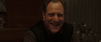Movie still from “Two Lovers” (2008), directed by James Gray – A person smiling with his mouth wide open; Close Up shot, Over the shoulder angle
