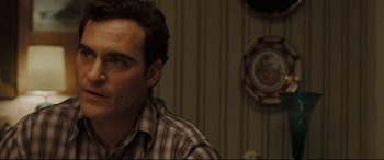 Movie still from “Two Lovers” (2008), directed by James Gray – A person wearing a plaid shirt; Close Up shot, Over the shoulder angle