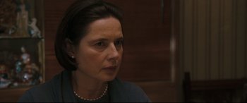 Movie still from “Two Lovers” (2008), directed by James Gray – A person wearing a necklace; Close Up shot, Over the shoulder angle