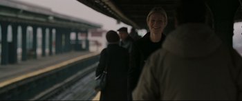 Movie still from “Two Lovers” (2008), directed by James Gray – A group of people standing on a train platform; Medium shot, Over the shoulder angle