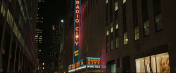 Movie still from “Two Lovers” (2008), directed by James Gray – The radio city music hall is lit up at night; Extreme Wide shot, High angle
