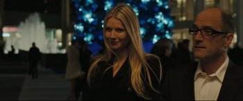Movie still from “Two Lovers” (2008), directed by James Gray – A woman with long blonde hair standing in front of a christmas tree; Close Up shot, Over the shoulder angle