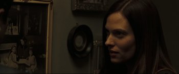 Movie still from “Two Lovers” (2008), directed by James Gray – A person in a room looking at a mirror; Close Up shot, Over the shoulder angle