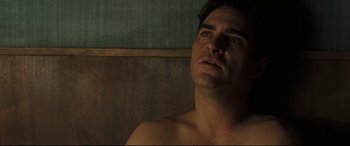 Movie still from “Two Lovers” (2008), directed by James Gray – A shirtless man looking up into the air; Close Up shot, Low angle