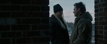 Movie still from “Two Lovers” (2008), directed by James Gray – A man and a woman standing next to each other; Medium shot, Over the shoulder angle