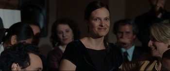 Movie still from “Two Lovers” (2008), directed by James Gray – A woman in a black dress is smiling for the camera; Close Up shot, Over the shoulder angle