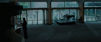 Movie still from “Two Lovers” (2008), directed by James Gray – A room that has a grand piano in it; Extreme Wide shot, High angle