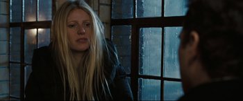 Movie still from “Two Lovers” (2008), directed by James Gray – A woman sitting in front of a window in the rain; Close Up shot, Low angle