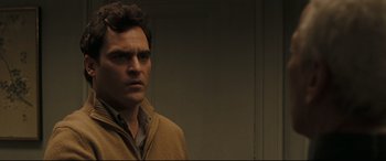 Movie still from “Two Lovers” (2008), directed by James Gray – A person wearing a jacket; Close Up shot, Over the shoulder angle