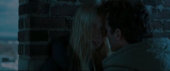 Movie still from “Two Lovers” (2008), directed by James Gray – A young man and a young blonde woman sitting next to each other; Close Up shot, Over the shoulder angle
