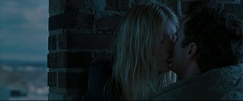 Movie still from “Two Lovers” (2008), directed by James Gray – A woman with long blonde hair sitting next to a brick wall; Close Up shot, Low angle