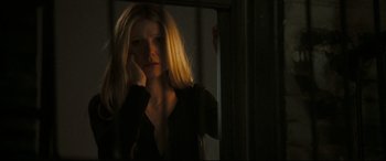 Movie still from “Two Lovers” (2008), directed by James Gray – A woman is standing in front of a mirror; Close Up shot, High angle