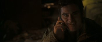 Movie still from “Two Lovers” (2008), directed by James Gray – A person talking on a cell phone; Close Up shot, Low angle