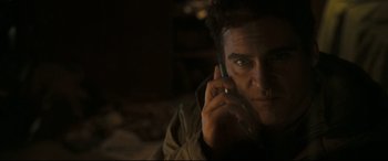 Movie still from “Two Lovers” (2008), directed by James Gray – A person talking on a cell phone; Close Up shot, Low angle