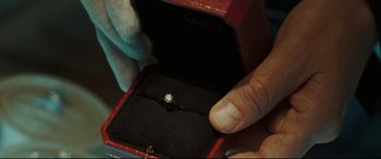 Movie still from “Two Lovers” (2008), directed by James Gray – A person is holding a diamond ring in a box; Extreme Close Up shot, High angle