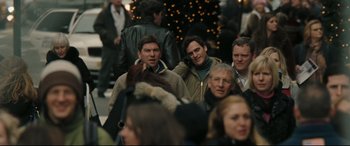 Movie still from “Two Lovers” (2008), directed by James Gray – A crowd of people walking down a street; Medium shot, Over the shoulder angle